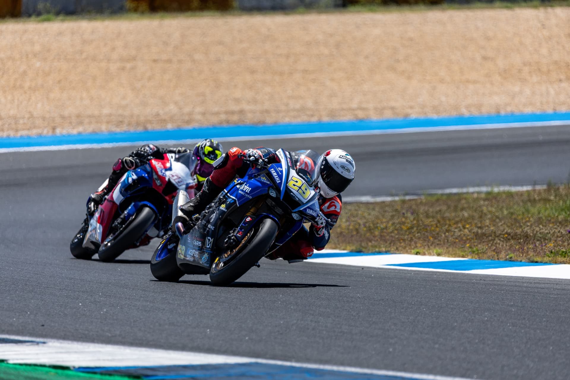 Superbike rider #29 leaning into a corner